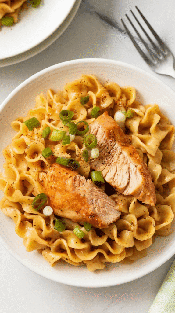 Garlic Butter Noodles with Chicken 2 a photo of a plate of garlic butter nood LetKGYf8QieTDK7tA7E45g 5pP6iUW SF 5PRcAZQsasA